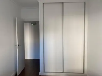 a sliding glass door in a room with a hallway at Acogedor apartamento en primera línea de playa in Canet de Berenguer