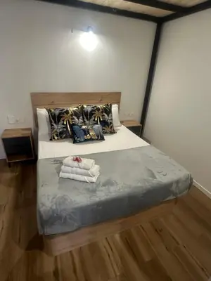 a bedroom with a bed with towels on it at Portobeach Valencia Suites in Valencia