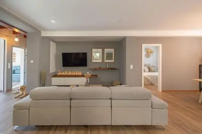a living room with a large white couch at Calm House, a 10 min playa de la de Cullera in Llaurí