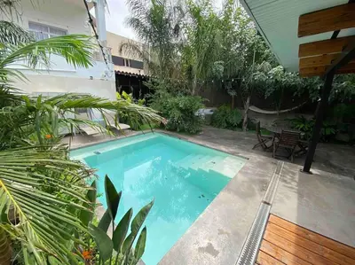 a swimming pool in the backyard of a house at Calm House, a 10 min playa de la de Cullera in Llaurí