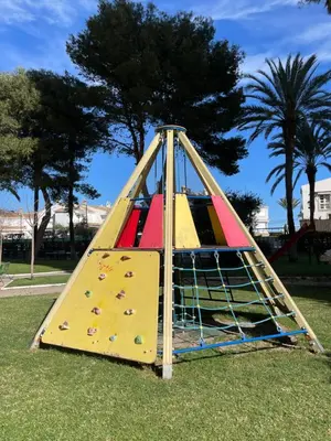 a play equipment in a park with a slide at Bungalow on the beach 15 minutes from Valencia in Valencia
