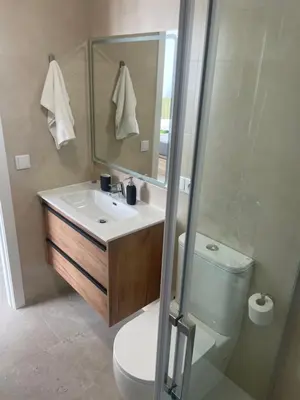 a bathroom with a sink and a toilet and a shower at Mar&Sol Flats by Vivo GC in Valencia