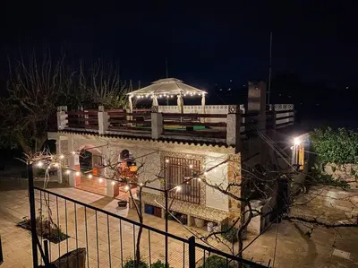 a building with a tent on top of it at night at Villa Caliqueña, casa de campo in Torrent