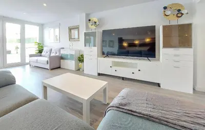 a living room with a large tv and a couch at Gorgeous Home In Riba-Roja De Turia in Riba-Roja De Turia