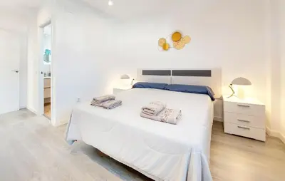 a bedroom with a white bed with two towels on it at Gorgeous Home In Riba-Roja De Turia in Riba-Roja De Turia