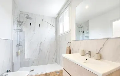 a white bathroom with a sink and a shower at Gorgeous Home In Riba-Roja De Turia in Riba-Roja De Turia