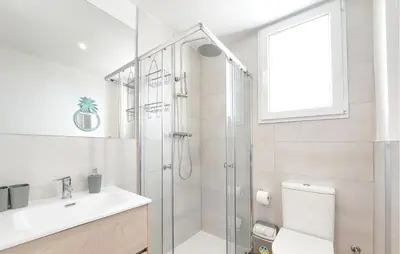a bathroom with a shower and a sink and a toilet at Gorgeous Home In Riba-Roja De Turia in Riba-Roja De Turia