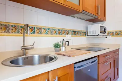 a kitchen with a sink and a counter top at Sunny Modern Flat by Mercado Central in Valencia
