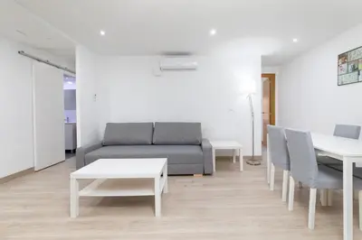 a living room with a couch and a table at Barraca Breeze in Valencia
