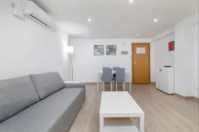 a living room with a couch and a table at Barraca Breeze in Valencia