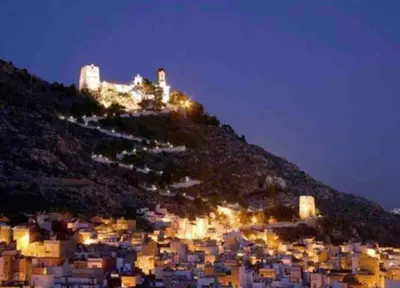 a view of a city at night at Piso a 3 minutos de la playa!! 6 personas in Cullera