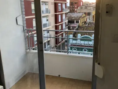 a room with a window with a view of a city at Relaxing Reina in Valencia