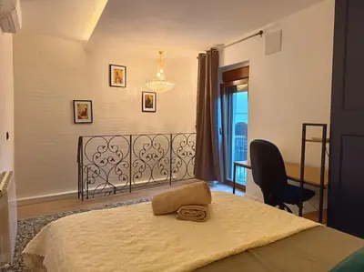 a bedroom with a bed and a chair and a window at loft Gilet 20 km Valencia montaña Senderismo Bici in Gilet