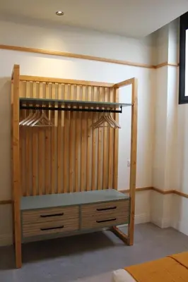 a wooden bunk bed in a room at Promotur Suites - Ayora in Valencia
