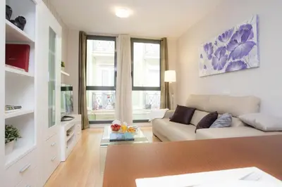 a living room with a couch and a table at SingularStays Comedias in Valencia
