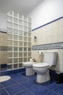 a bathroom with a toilet and a sink at Casona Torrent in Torrent