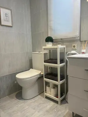 a bathroom with a toilet and a sink at Estación Central Family Home in Valencia