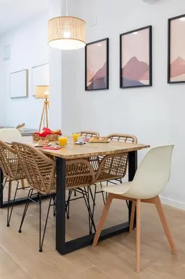 a dining room with a table and chairs at Travel Habitat Zaidia con Terraza in Valencia