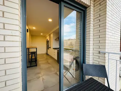 a sliding glass door to a balcony with a view at Diyenn Burriana alojamiento y placer in Burriana