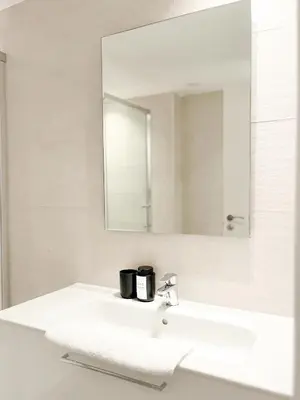 a bathroom with a sink and a mirror at Diyenn Burriana alojamiento y placer in Burriana