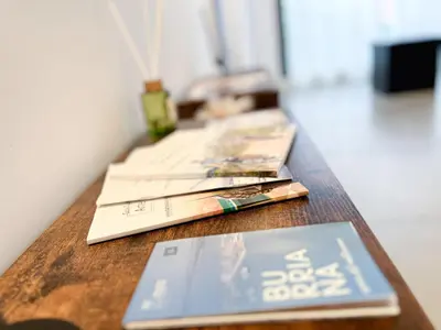 a wooden table with books on top of it at Diyenn Burriana alojamiento y placer in Burriana