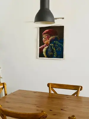 a dining room table with a picture of a woman at VILLA FALI in Benaguacil