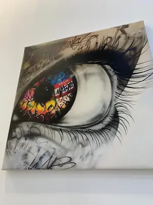 a drawing of an eye with graffiti at Luna y Sol in Valencia