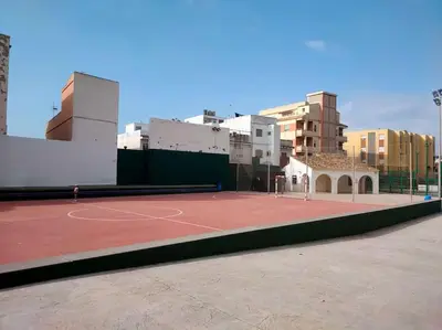 a tennis court in the middle of a city at Modern Apartment Frontline Beach in Mareny Blau