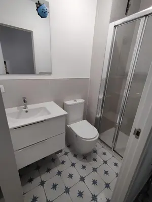 a bathroom with a toilet and a sink and a shower at SuecaRoom Prime Experience in Sueca