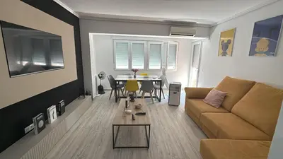 a living room with a couch and a table at SuecaRoom Prime Experience in Sueca