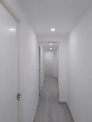 an empty hallway with white walls and wooden floors at SuecaRoom Prime Experience in Sueca