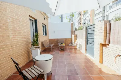 a balcony with a white board on a brick wall at Casa Pancho, ChillOut, Oceanographic, City of Arts in Valencia