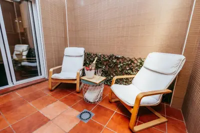 two chairs and a table on a porch at Casa Pancho, ChillOut, Oceanographic, City of Arts in Valencia