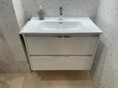 a white bathroom sink with a candle on it at Excelente ático con gran terraza y barbacoa en Canet d'en Berenguer in Valencia