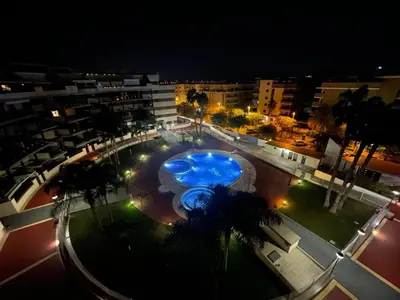 an overhead view of a swimming pool at night at Excelente ático con gran terraza y barbacoa en Canet d'en Berenguer in Valencia