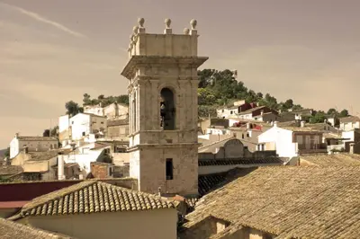 an old building with a bell tower in a village at Villa Torre Macastre, Valencia in Macastre