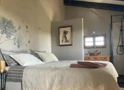 a bedroom with a large white bed with a window at Villa Torre Macastre, Valencia in Macastre