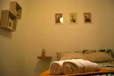 a bedroom with a bed with two towels on it at Habitación céntrica in Valencia