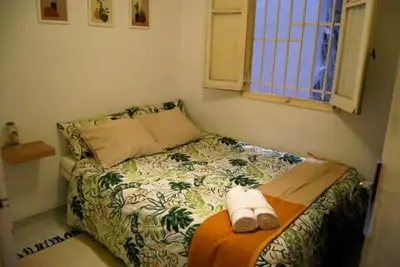 a small bedroom with a bed with towels on it at Habitación céntrica in Valencia