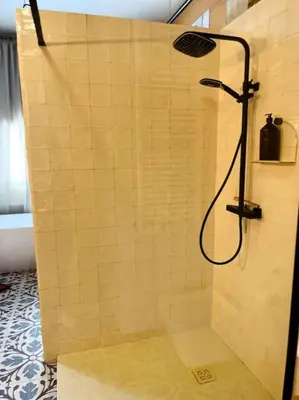 a shower with a shower head in a bathroom at Loft a 5min de la playa in Valencia