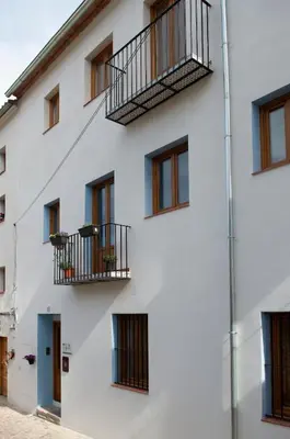 a white building with windows and balconies at Mar de fonts ain in Ahín