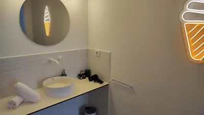 a white sink sitting on a counter in a bathroom at CariSan2 - fully equipped, 6 min to beach in Valencia