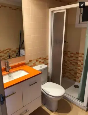 a bathroom with a toilet and a sink and a shower at Vistas espectaculares 
