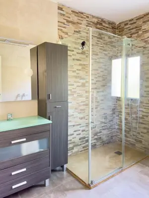 a bathroom with a shower with a glass door at Apartamento Los Narcisos 2 in Chulilla