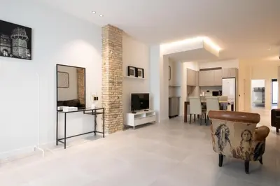 a living room with a dining room and a kitchen at Luxury Apartment City Center in Valencia