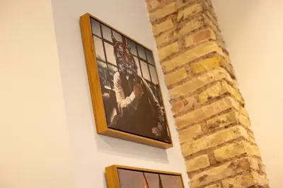 a picture hanging on a wall with a brick wall at Luxury Apartment City Center in Valencia