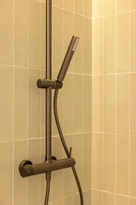 a toothbrush holder in a bathroom with white tiles at Luxury Apartment City Center in Valencia