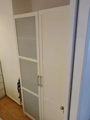 a pair of white cabinets in a room at HAWAI, Esc-2, 3-10 in Cullera