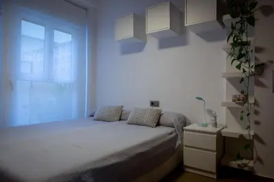 a bedroom with a bed and a window at Patacona Sunrises Premium in Valencia