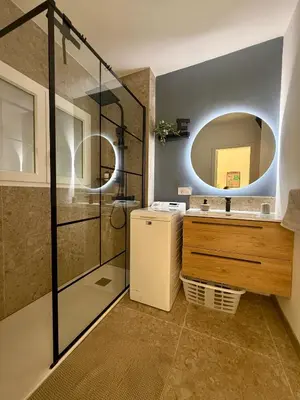 a bathroom with a sink and a mirror at El Bikini Cullera - Junto a la playa - Right on the beach in Cullera